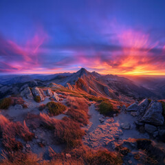 Fototapeta premium A picturesque sunrise over the mountains, highlighting the beauty of nature in the early morning light.