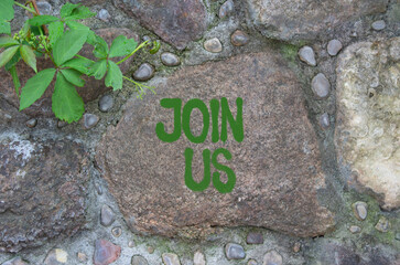 Join us symbol. Concept word Join us on stone wall. Beautiful stone background. Business and Join...