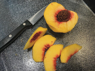 Fresh Peach Slices and a Half with Pairing Knife