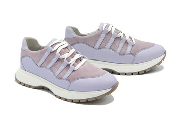 Sneakers. Pair of fashionable leather with suede inserts shoes isolated on white background.