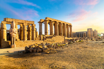 Early sunset view of the ancient Karnak Temple complex along the Nile River in the Egyptian city of...