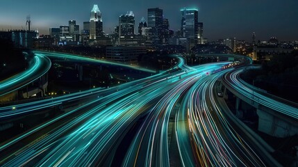 Fototapeta premium Stunning cityscape with vibrant light trails from moving vehicles, showcasing urban nightlife and modern architecture.
