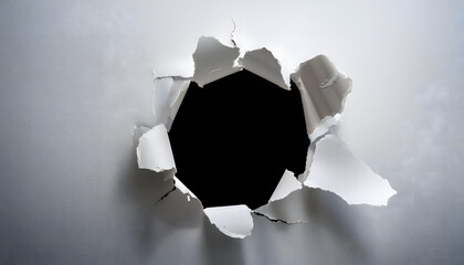hole in breaking through white wall