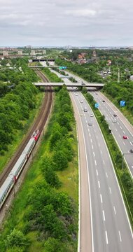 Aerial drone view of the European route E20 on a cloudy day. Vertical