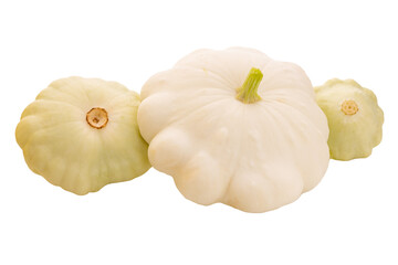three young and fresh white pattypan squashes