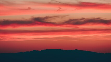 Obraz premium A beautiful sunset with pink and orange clouds in the sky