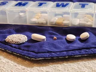 Candy mixed with prescription pills on placemat