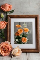 A framed picture of a bouquet of flowers with a white background