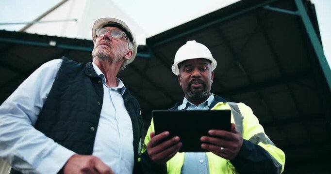 Businessmen, contractor and architect with tablet for construction, planning or maintenance at site. Man, civil engineer or colleagues with techology for architecture, industrial building or change