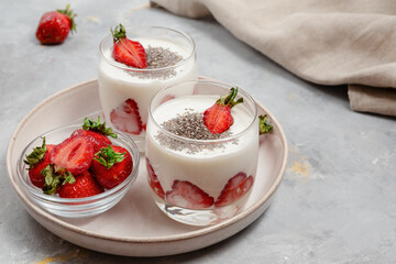 Fresh Strawberry Yogurt Dessert With Chia Seeds In Glass
