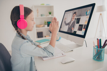 Photo of cute small girl raise arm study computer screen teacher desktop wear shirt modern...