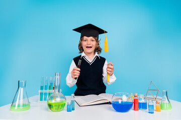 Photo of clever diligent intelligent boy learn chemistry subject science experiment research isolated on blue color background