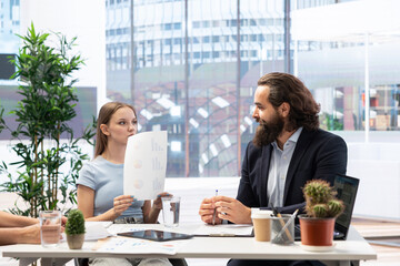Student loan advisor in office assisting teenager in fixing debt, helping her choose best repayment plan. Credit counselor offering legal advice to girl to lower her loan payments