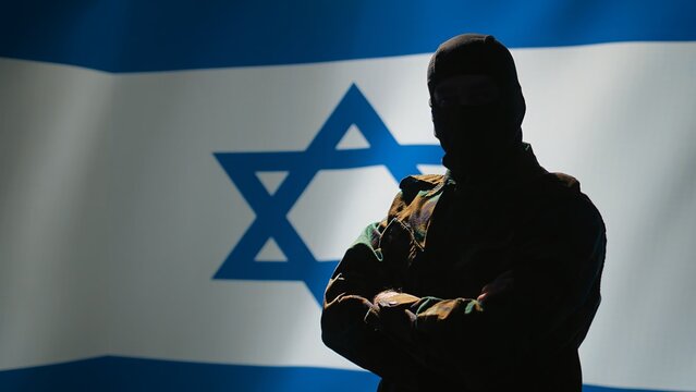 Mossad agent standing proud in front of Israel flag, feeling pride in serving country. Israeli jewish army personnel in war room crossing arms, listening national anthem, camera B