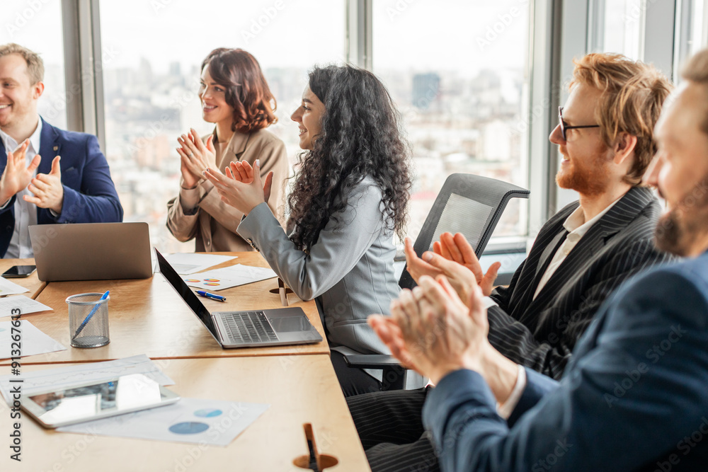 Aufkleber a group of business professionals sit around a table in a modern office, clapping their hands in app