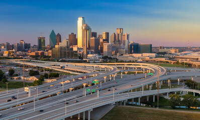 Traffic driving on Tom Landry Freeway intersection and a view to downtown Dallas, Texas, United...