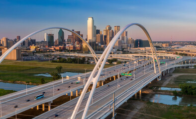 Traffic driving over Margaret McDermott Bridge and a view to downtown Dallas, Texas, United States.