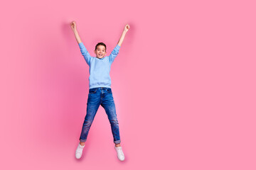 Full length photo of charming teen boy hanging handrail empty space dressed stylish blue garment isolated on pink color background