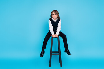 Photo of nice adorable boy wear uniform study school isolated on blue color background