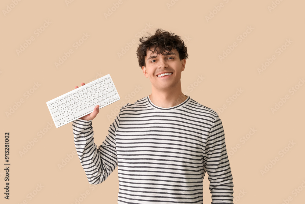 Poster young man with computer keyboard on beige background