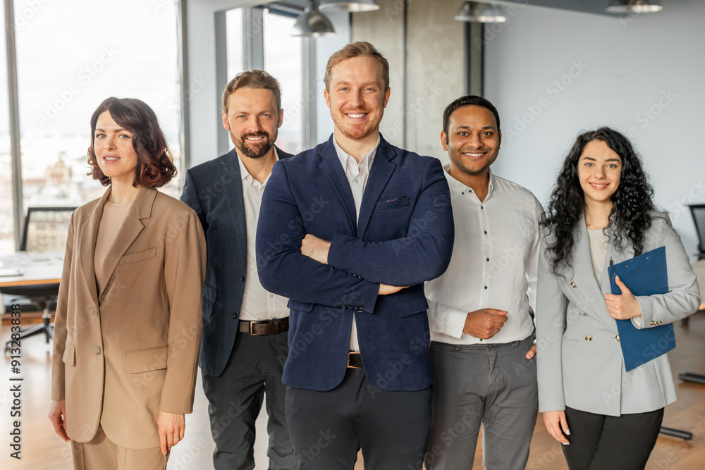 Aufkleber a diverse group of five business professionals stand together in a modern office setting. they are a