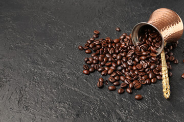 Pot with coffee beans on dark grunge background
