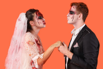 Zombie wedding couple on orange background