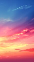 Fototapeta premium A vibrant sky with hues of pink, orange, yellow and blue, creating a dramatic and colorful sunset.
