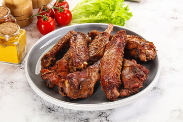 Roasted duck wings with sauce