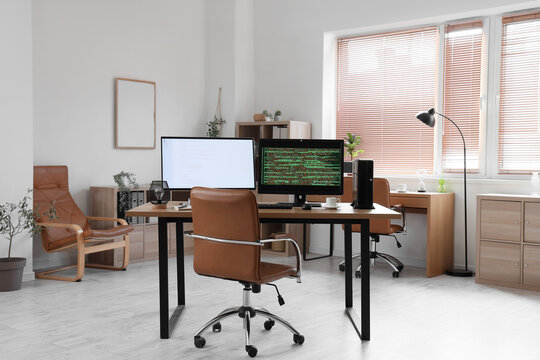 Modern workplace of programmer with computer in office