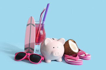 Piggy bank, cocktail, sunglasses, coconut, decorative flip-flops and surfboard on blue background
