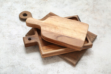 Different wooden cutting boards on white background