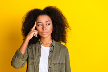 Photo of minded unsure girl with perming coiffure wear khaki shirt thoughtfully look empty space...