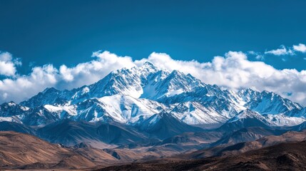 Majestic Snowy Mountain Range Under a Clear Blue Sky