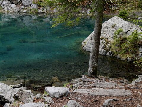 Lac vert, emerald turquoise water natural background in Passy, Haute savoie, france. Alpine lake