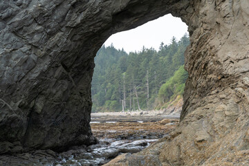 A beautiful view of giant rocks and ocean at Rialto Beach on a cloud day.
