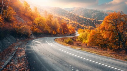 Naklejka premium Winding road with picturesque autumn trees in the mountainous area generative ai