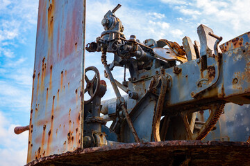 An old, weathered artillery cannon displayed outdoors as a historical monument