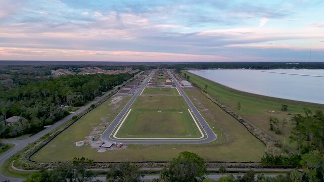 Aerial view of row of new construction of luxury homes by the lake in Sanford, Orlando, Florida.