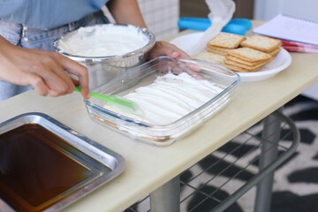 Woman Making A Non-bake Dessert or Cake. Cooking And Home Concept.