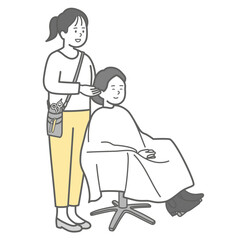 ヘアサロンで髪のカウンセリングする美容師とお客さん