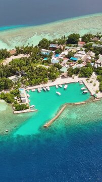 Aerial drone view of the boat harbor in Thinadhoo island, Maldives