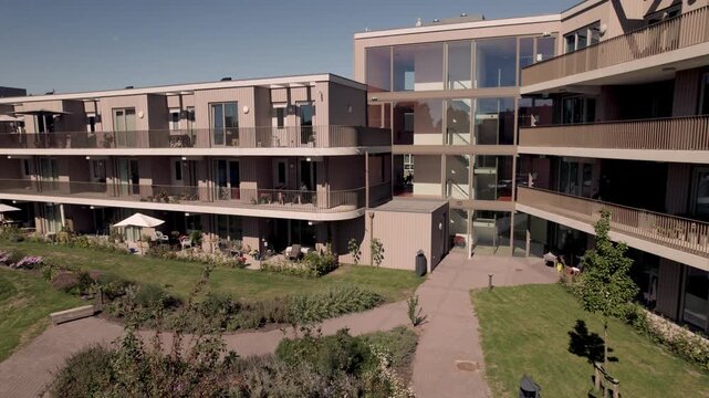 Aerial showing Dutch residential urban development and infrastructure of Noorderhaven apartment building in Zutphen, The Netherlands, with staircase leading to floors and galleries