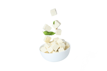 PNG,Cubes of tofu in a bowl with leaves, isolated on white background