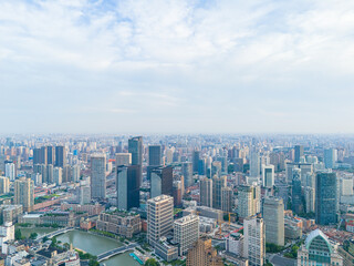 Aerial view of modern city skyline and buildings at sunrise in Shanghai
