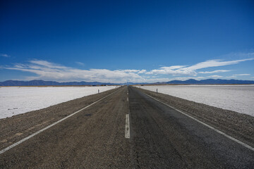 paved road that crosses the salt flats