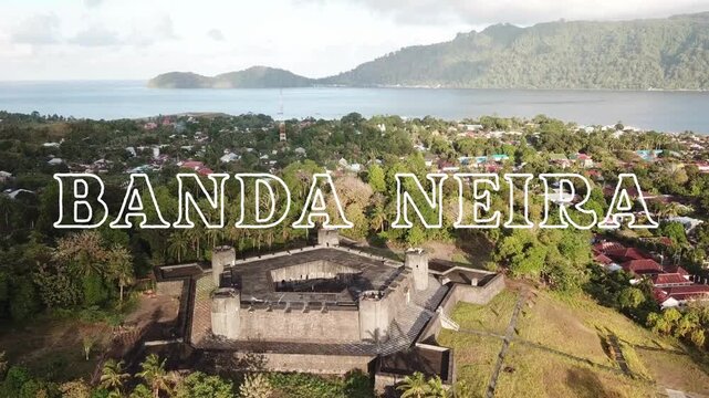 Landscape video with the text "Welcome to Banda Neira" written in white on a beautiful aerial view of Belgica Fortress in Banda Neira island, Maluku, Indonesia as video background
