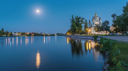 Obraz premium Nighttime Reflection of a Church by the Lake