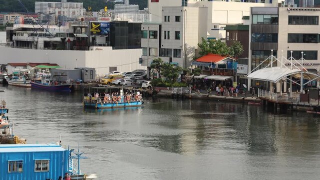 Sokcho, South Korea - July 28th, 2024: The Abai Village Ferry docks at the bustling waterfront of Abai Village, offering a glimpse of daily life and the vibrant atmosphere of this historical area.