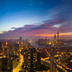 Fototapeta premium Aerial view of modern city skyline and buildings at sunrise in Shanghai